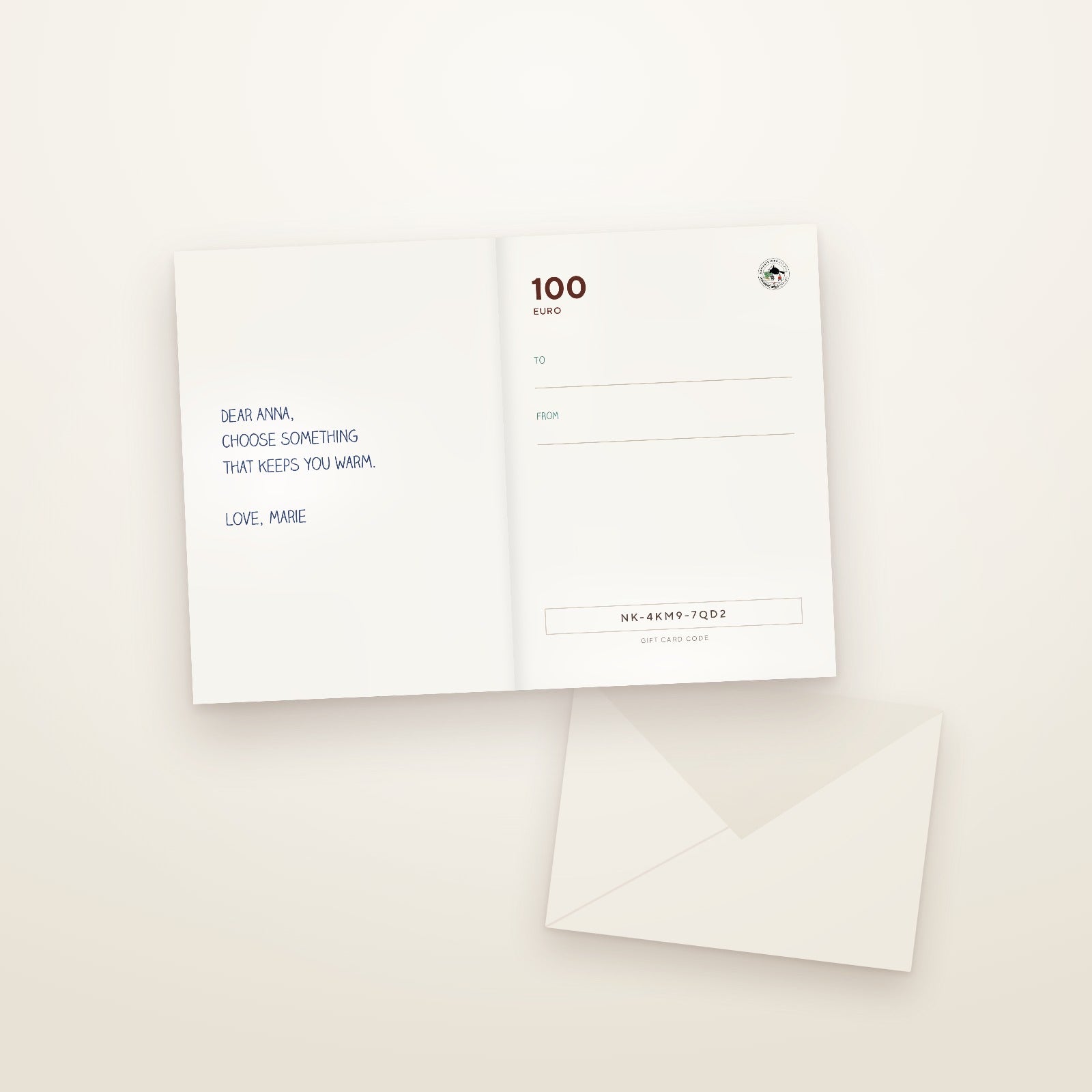 Opened voucher card: on the left, free space for your own lines; on the right, the amount and voucher code; the envelope beside it